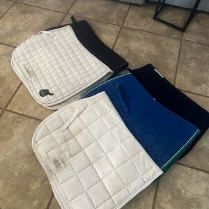 Five all purpose saddle pads
